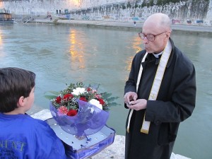 Msgr. Barreiro blessing the flowers.