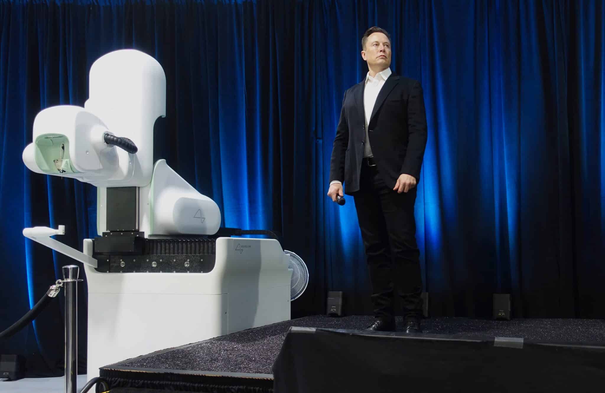 "<a href="https://www.flickr.com/photos/jurvetson/50280652497/" target="_blank" rel="noopener">Elon Musk and the Neuralink Future</a>" by <a href="https://www.flickr.com/people/jurvetson/" target="_blank" rel="noopener">Steve Jurvetson</a> is licensed under <a href="https://creativecommons.org/licenses/by/2.0/deed.en" target="_blank" rel="noopener">CC Attribution 2.0 Generic License</a>.