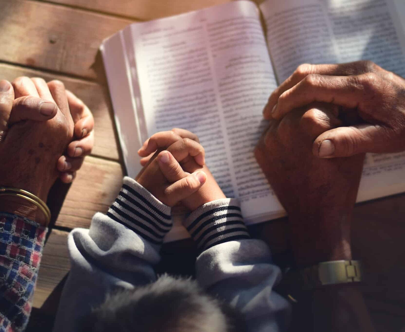 The boy prayed on the table. The family prayed together.